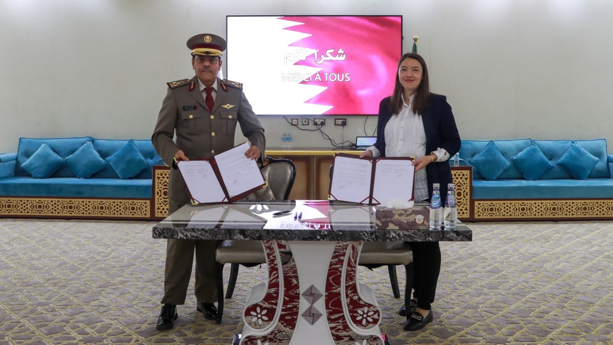 Acting Commander of the Language Institute, Brig Khalid Hamad Al-Kaabi, and Deputy Director of the French Institute, Margaux Girard during the signing ceremony.
