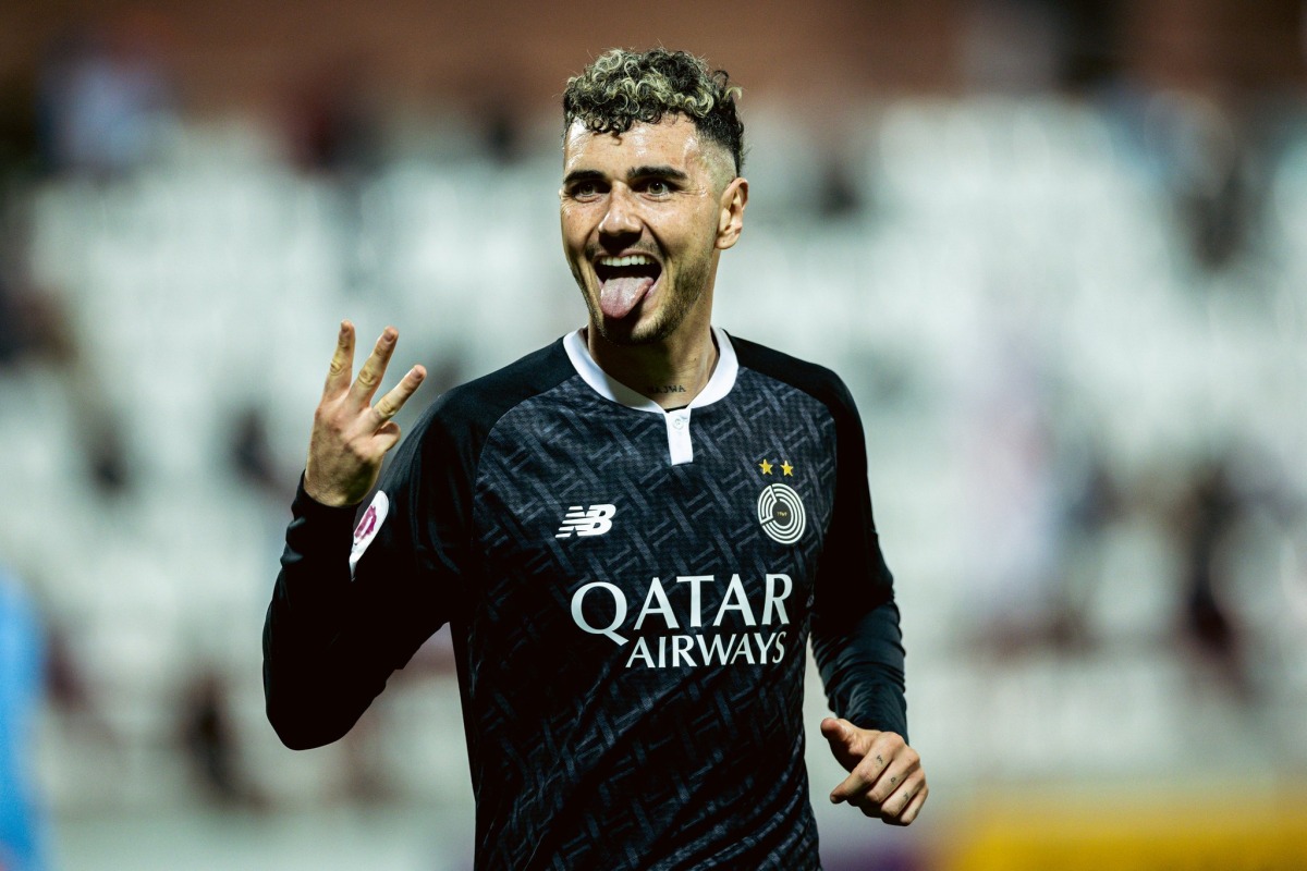 Al Sadd's Rafa Mujica gestures after completing his hat-trick. 