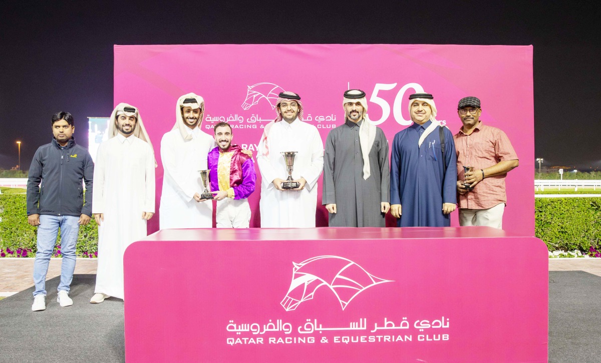 The connections of Hadi De Carrere pose with their trophies. Head of QREC Racing Operations Section Rashid Saed Adiba crowned the winners. PICS: Juhaim/QREC