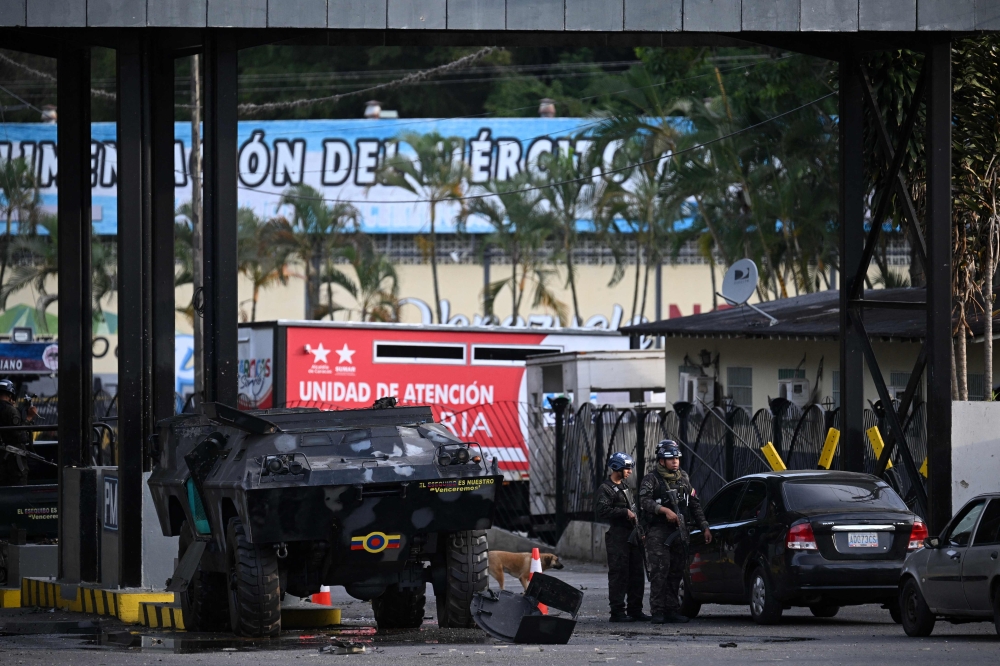 Members of the National Guard stand guard at Fuerte Tiuna, Venezuela's largest military complex, in Caracas on January 3, 2026. (Photo by Federico Parra / AFP)