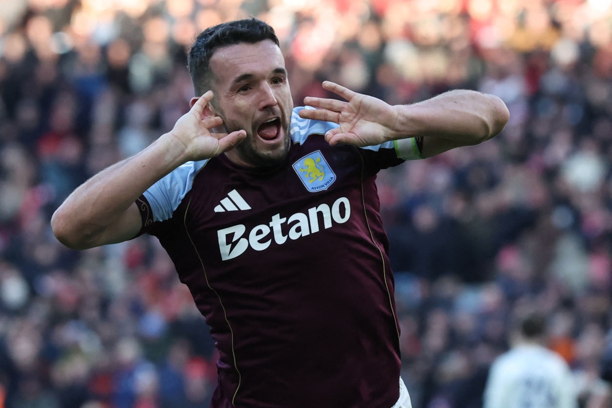 Aston Villa's Scottish midfielder John McGinn celebrates after scoring their third goal during the English Premier League football match between Aston Villa and Nottingham Forest at Villa Park in Birmingham, central England on January 3, 2026. (Photo by Darren Staples / AFP) 
