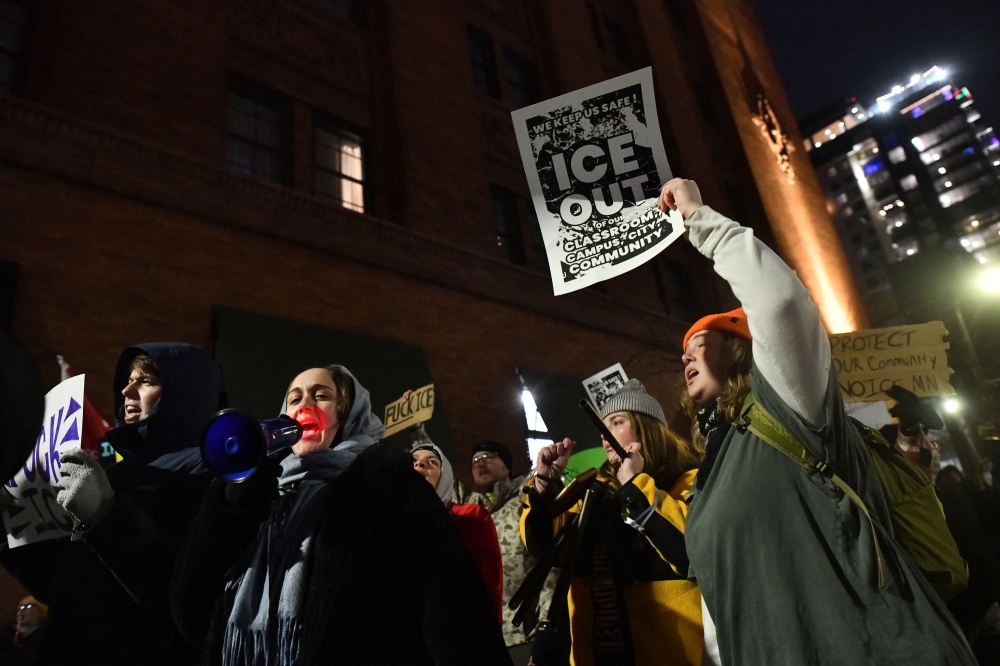 People march in protest against ICE after the fatal shooting of Renee Nicole Good in downtown Minneapolis, Minnesota on January 9, 2026. A US Immigration and Customs Enforcement (ICE) agent shot and killed 37-year-old Renee Nicole Good on the streets of Minneapolis on January 7, leading to huge protests and outrage from local leaders (Photo by Octavio Jones / AFP)