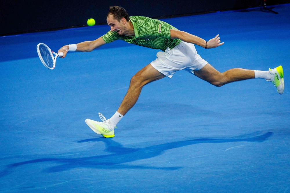 Daniil Medvedev of Russia hits a return during his men's singles final against Brandon Nakashima of the US at the Brisbane International tennis tournament in Brisbane on January 11, 2026. (Photo by Patrick Hamilton / AFP)