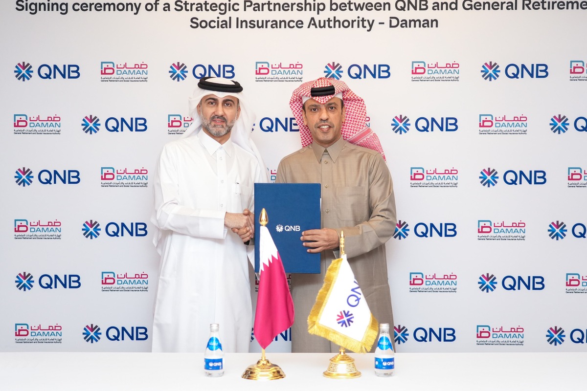 QNB Group CEO Abdulla Mubarak Al Khalifa and Director General of Daman Ahmed bin Ali Al Hammadi during the agreement signing.