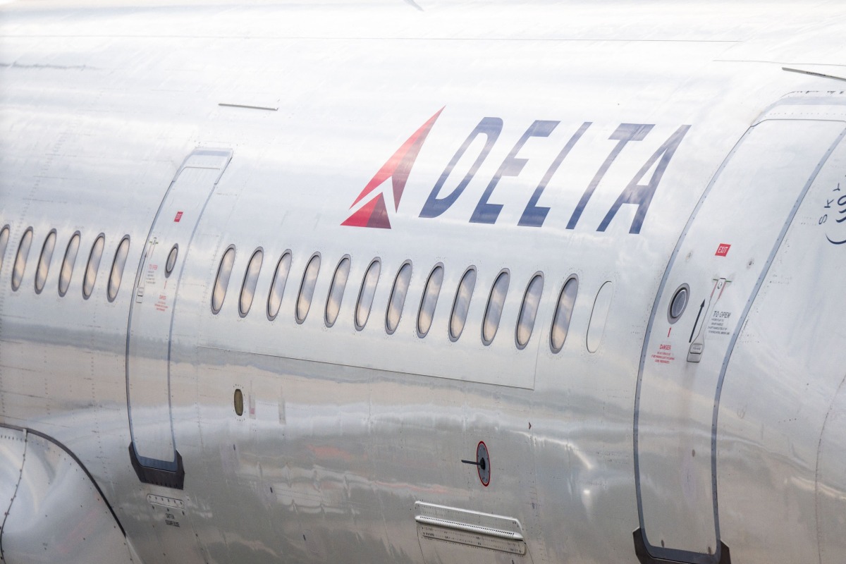 A Delta Airlines plane is stationed at a gate at the Austin-Bergstrom International Airport on January 12, 2026 in Austin, Texas. Photo by Brandon Bell / GETTY IMAGES NORTH AMERICA / Getty Images via AFP