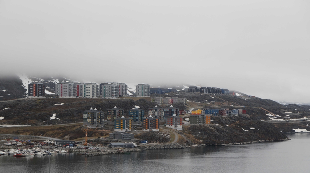 (Files) Houses are pictured in Nuuk, Greenland, on June 15, 2025. (Photo by Ludovic MARIN / AFP)

