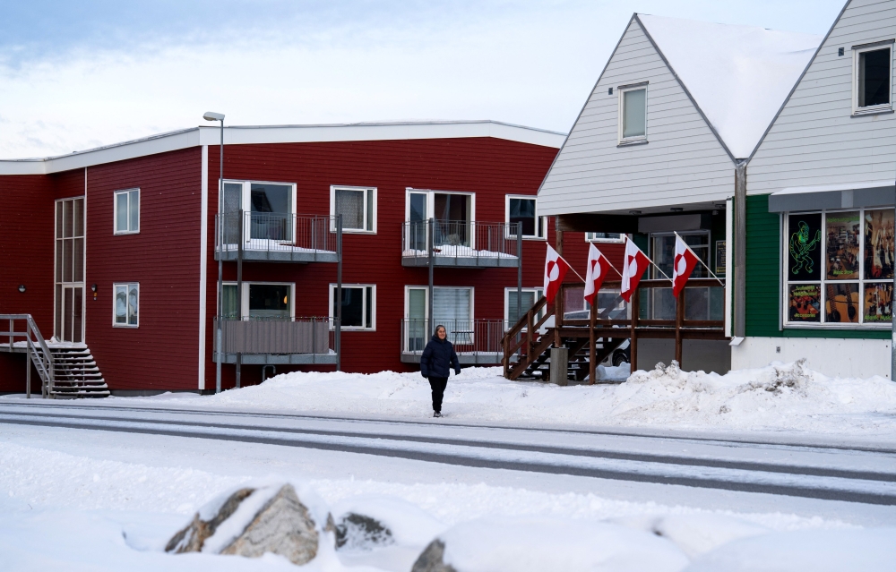 Greenlandic flags are fixed on a building in Nuuk, Greenland, on January 14, 2026.  (Photo by Alessandro Rampazzo / AFP)