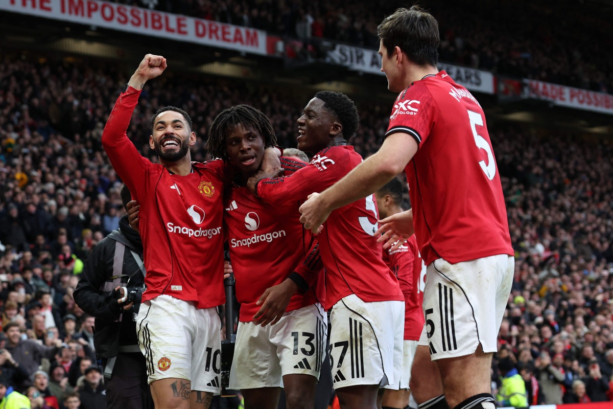 Manchester United's Danish defender #13 Patrick Dorgu (2L) celebrates with teammates after scoring their second goal during the English Premier League football match between Manchester United and Manchester City at Old Trafford in Manchester, north west England, on January 17, 2026. (Photo by Darren Staples / AFP) 