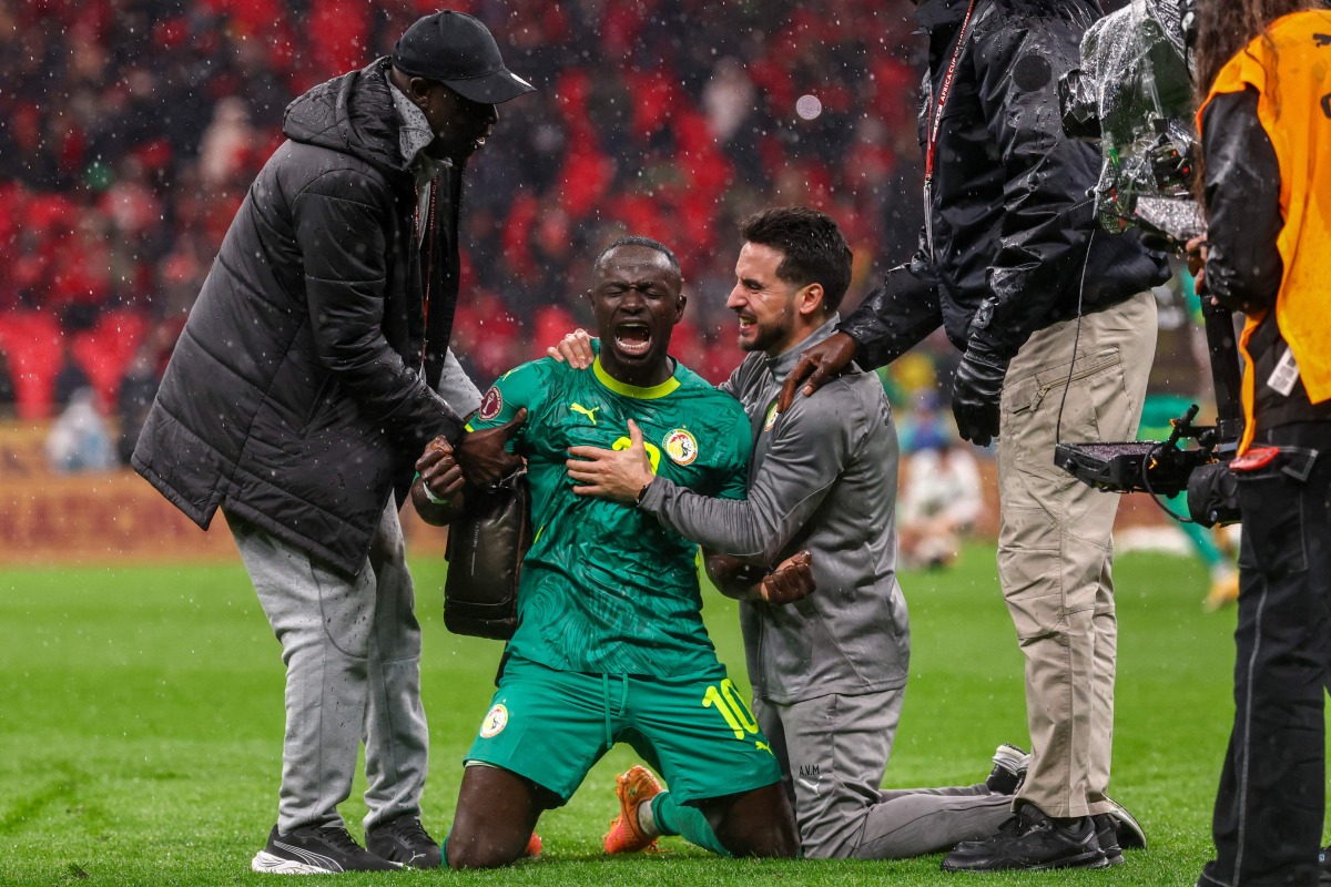 Senegal's forward #10 Sadio Mane and team members celebrate their victory at the end of the Africa Cup of Nations (CAN) final football match between Senegal and Morocco at the Prince Moulay Abdellah Stadium in Rabat on January 18, 2026. (Photo by FRANCK FIFE / AFP)