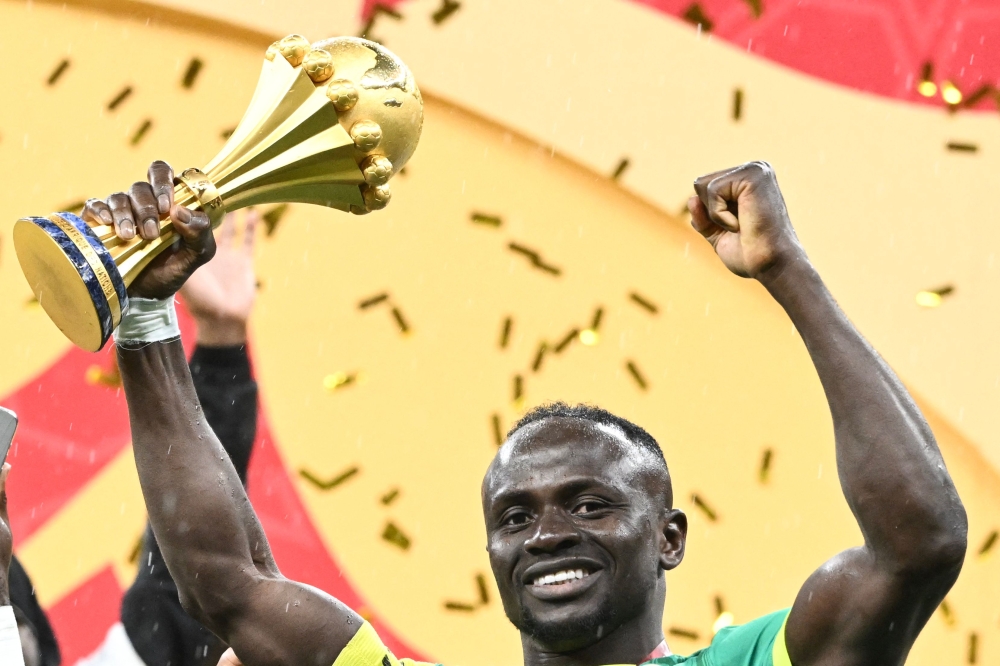 Senegal's forward #10 Sadio Mane holds the trophy after the Africa Cup of Nations (CAN) final football match between Senegal and Morocco at the Prince Moulay Abdellah Stadium in Rabat on January 18, 2026. (Photo by Sebastien Bozon / AFP)