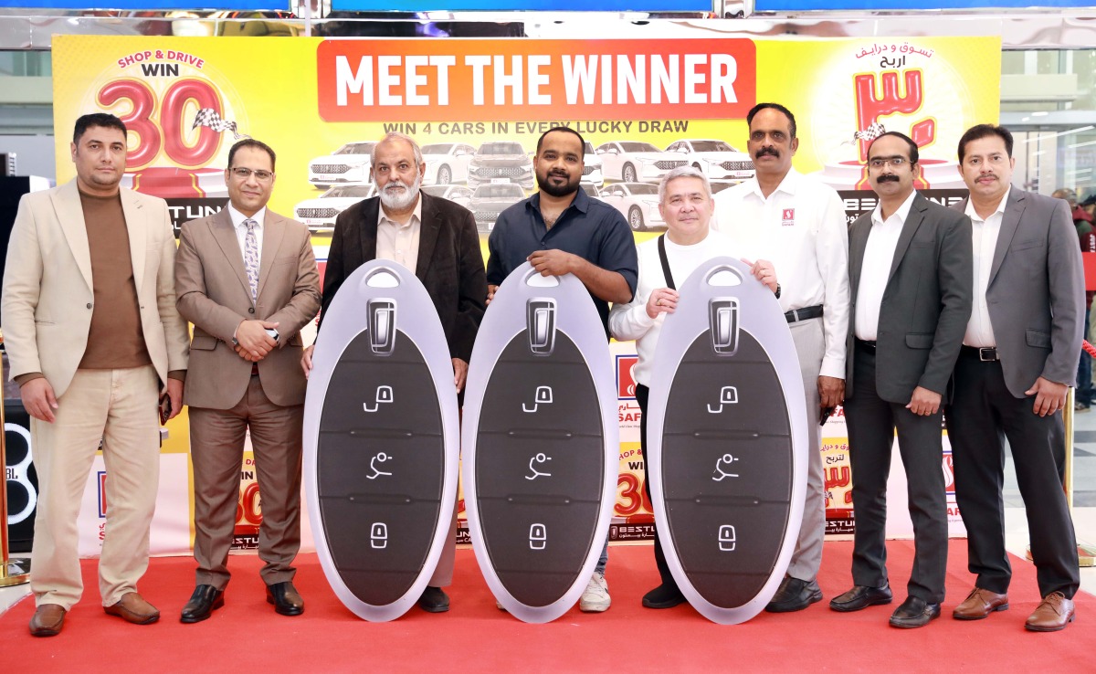 Safari Hypermarket officials with the draw winners.