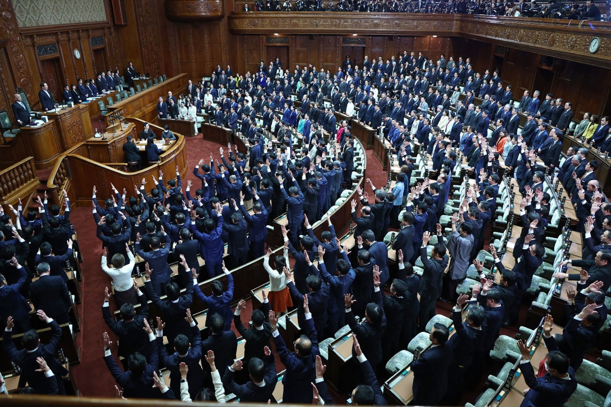 Lawmakers cheer as the House of Representatives is dissolved at the Diet in Tokyo on January 23, 2026. Photo by JIJI Press / AFP
