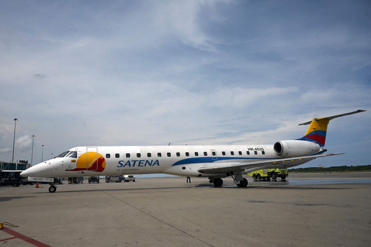 File photo of a Satena Airlines aircraft covering the route Bogota-Caracas is pictured upon arrival at Simon Bolivar International Airport in Venezuela, on November 9, 2022. (Photo by Federico PARRA / AFP)