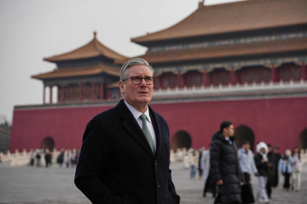 Britain's Prime Minister Keir Starmer visits the Forbidden City in Beijing on January 29, 2026. (Photo by Kin Cheung / AFP)