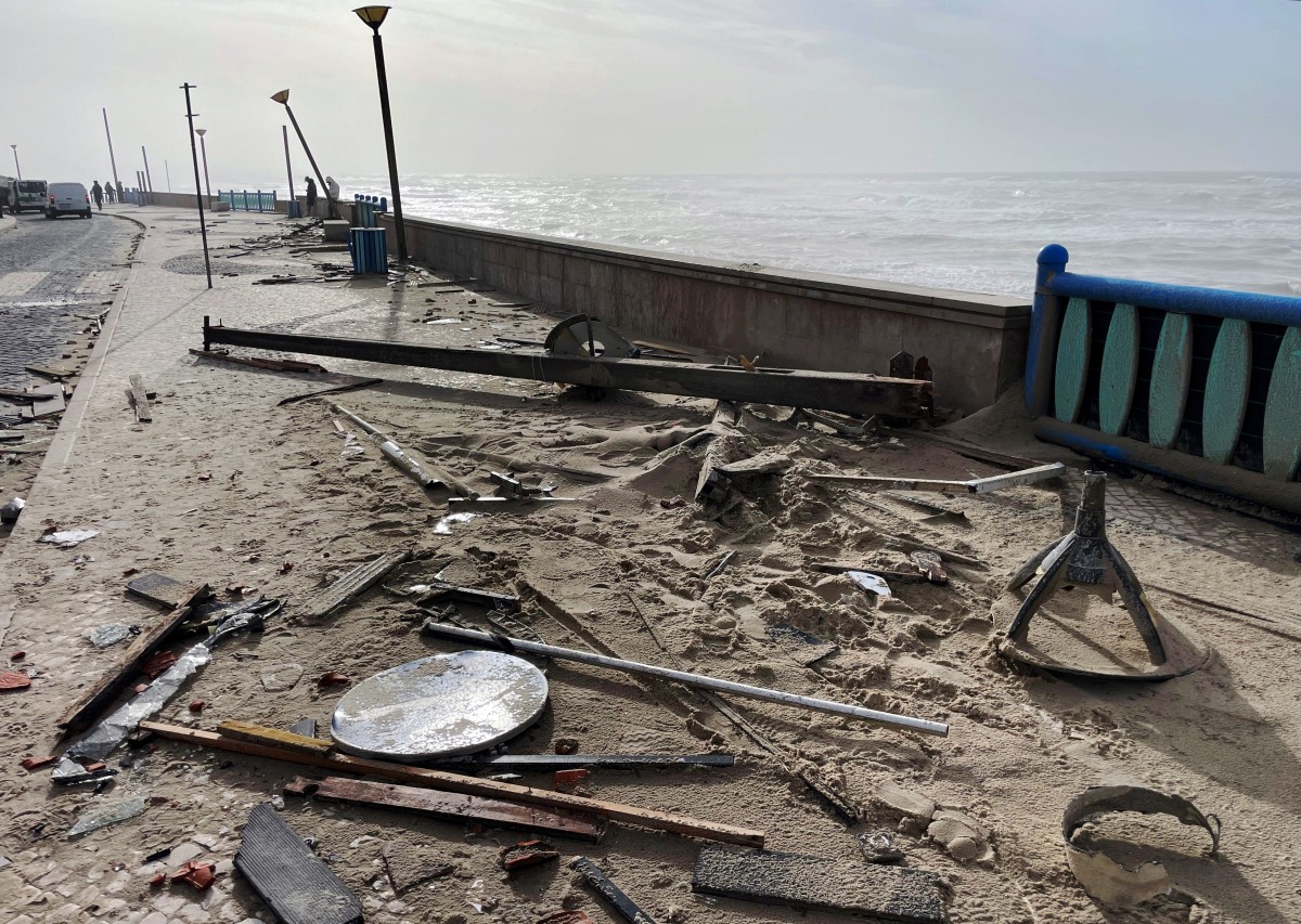 Debris and sand are pictured on a pavement along the coast in Praia da Vieira, after storm Kristin hit Portugal, on January 29, 2026. Photo by Jerome Pin / AFP