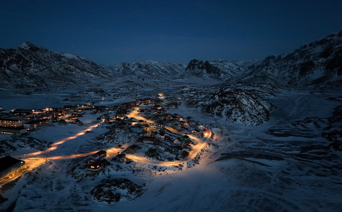 An aerial view shows the city of Sisimiut, Greenland on January 30, 2026. (Photo by Ina FASSBENDER / AFP)