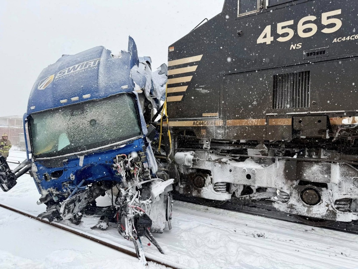 This handout image released by the Gastonia Police Department shows a semi-truck struck by a freight train at the intersection of Poplar Street and Airline Avenue in Gastonia, north of downtown Charlotte, North Carolina on January 31, 2026 amid a winter snowstorm affecting the region. Photo by Gastonia Police Department / AFP