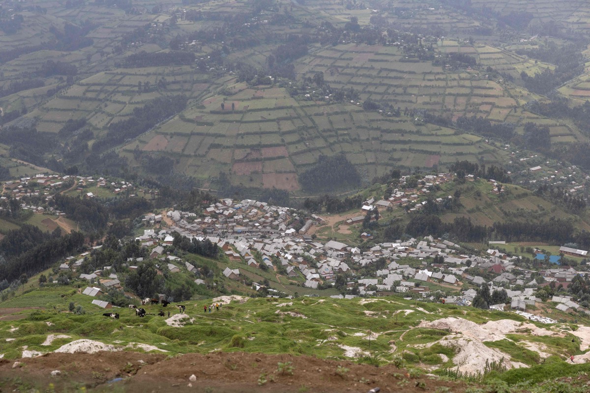 (FILES) A general view of the mine pits and the town in Rubaya on March 5, 2025.  (Photo by Camille Laffont / AFP)
