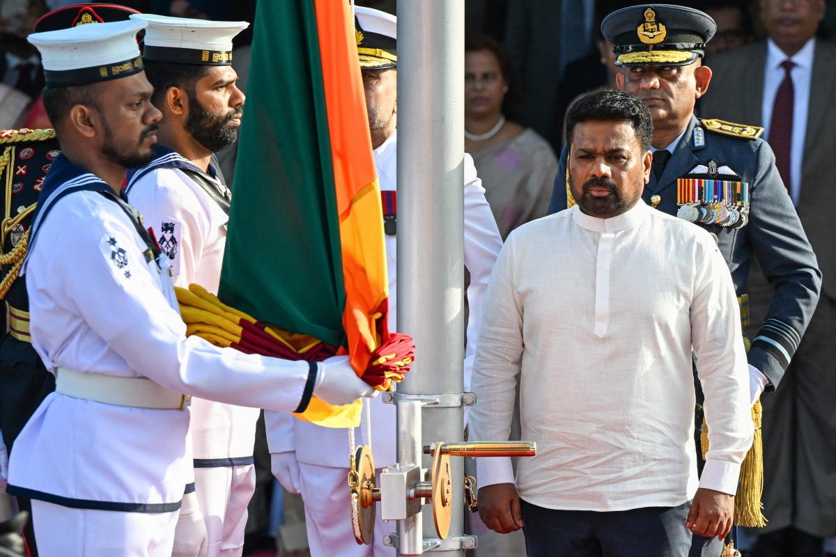 Sri Lanka's President Anura Kumara Dissanayake (front, R) arrives to hoist the national flag during the country's 78th Independence Day celebrations at Independence Square in Colombo on February 4, 2026. (Photo by Ishara S. KODIKARA / AFP)