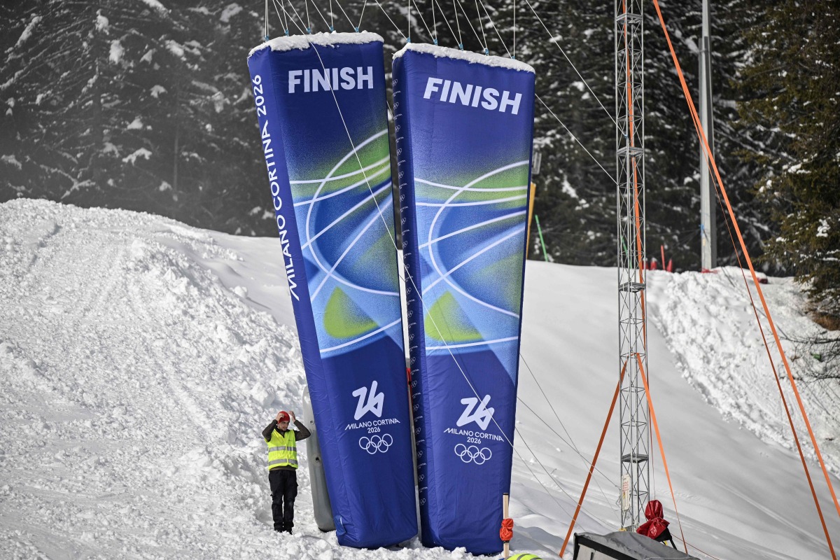 A staff stands next to pillars reading 
