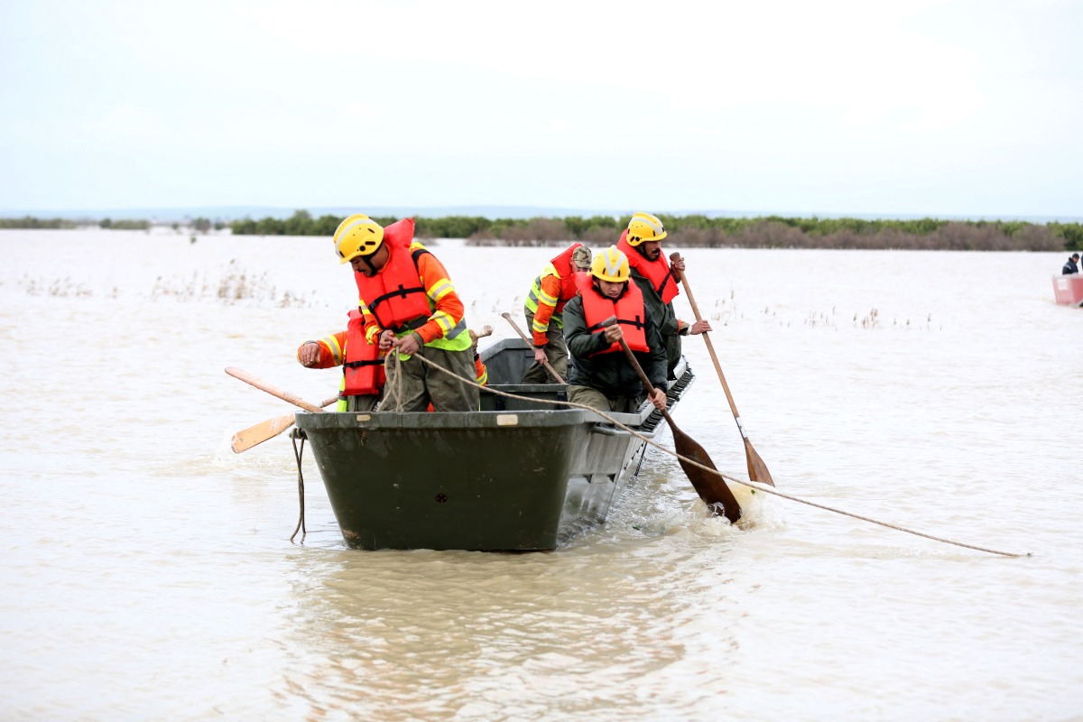 Civil defence rescuers ride in a boat on flood waters in the Sidi Kacem region, in northwestern morocco on February 5, 2026. (Photo by AFP)
