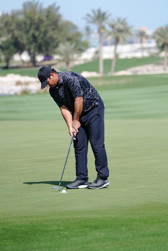 Patrick Reed of the United States lines up a crucial putt on Day 1 of the 29th Qatar Masters yesterday.