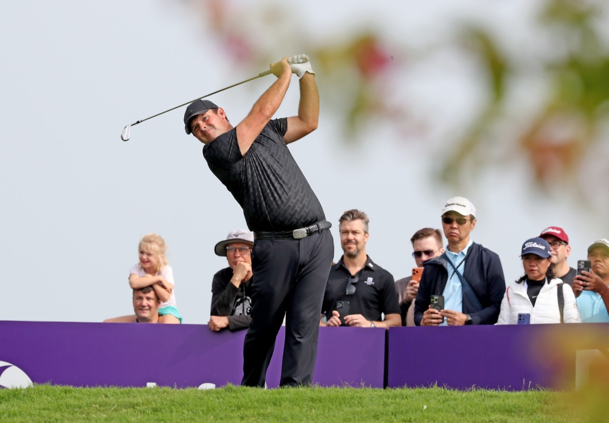 US golfer Patrick Reed plays a shot during the third day of the Qatar Masters at Doha Golf Club. 