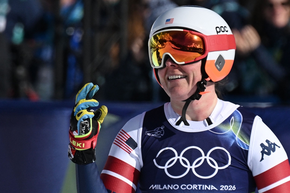 US' Breezy Johnson reacts in the finish area after competing in the women's downhill event during the Milano Cortina 2026 Winter Olympic Games. (Photo by Tiziana FABI / AFP)