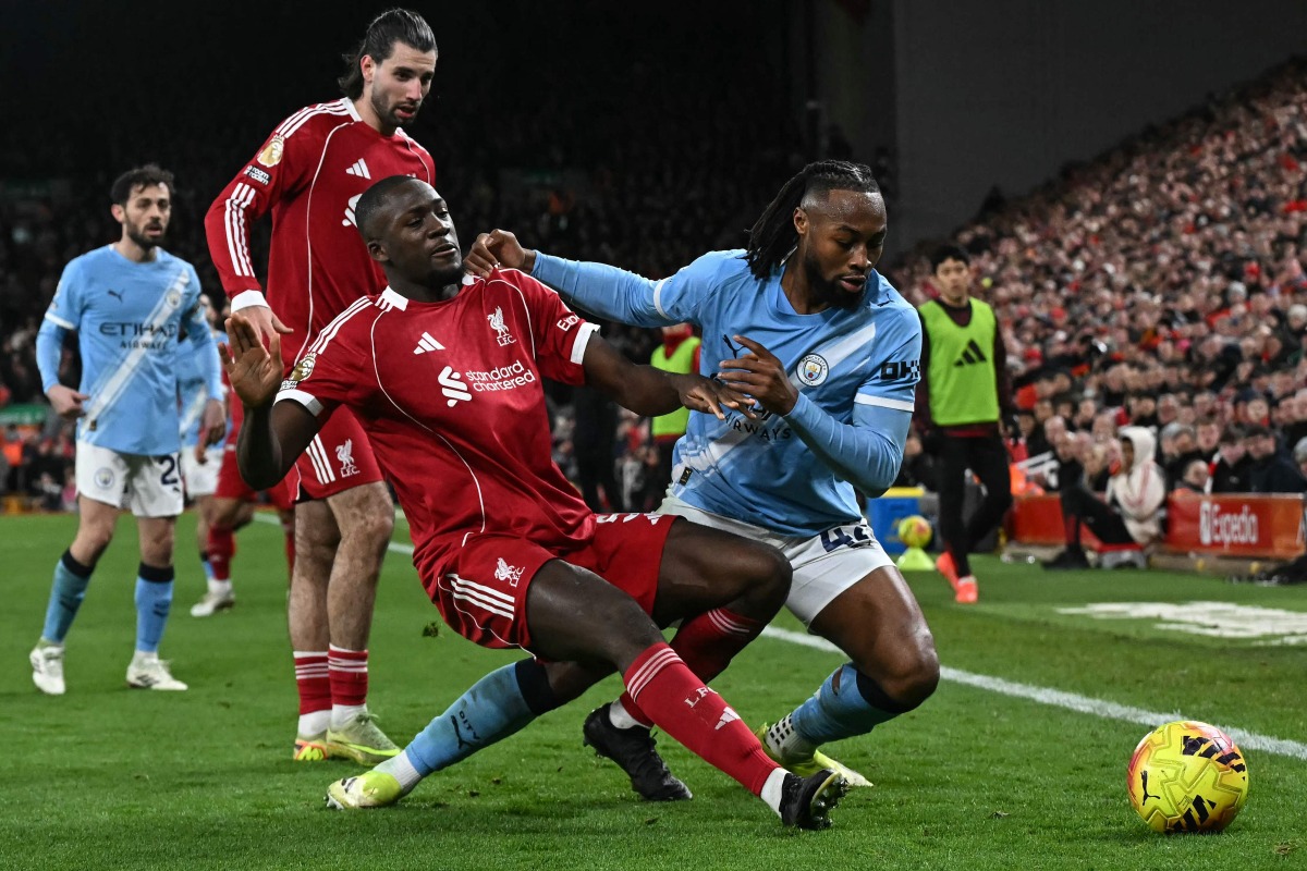 Manchester City's Ghanaian midfielder #42 Antoine Semenyo (R) fouls Liverpool's French defender #05 Ibrahima Konate (front L) which results in a free kick during the English Premier League football match between Liverpool and Manchester City at Anfield in Liverpool, on February 8, 2026. (Photo by Paul ELLIS / AFP)