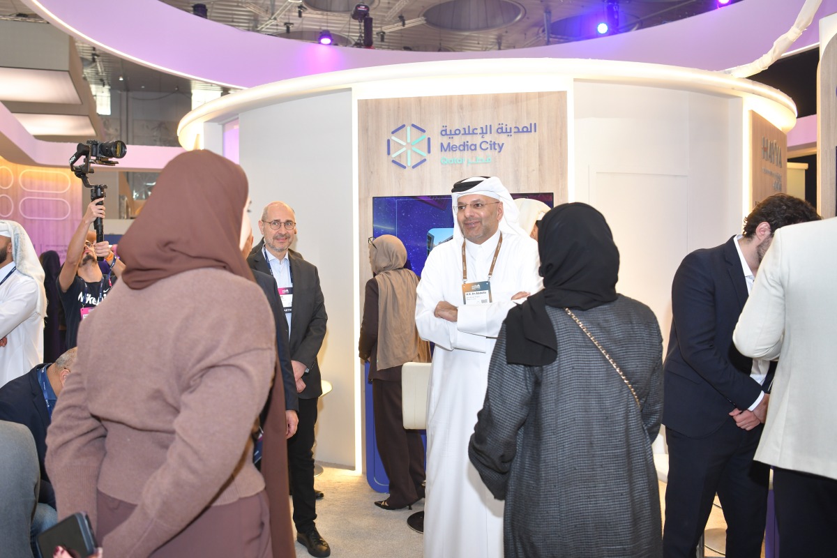Visitors at the Media City booth during the Web Summit Qatar.