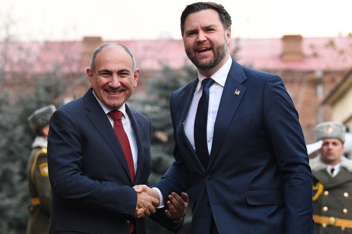 Armenian Prime Minister Nikol Pashinyan welcomes US Vice President JD Vance prior to their meeting in Yerevan yesterday.(AFP)