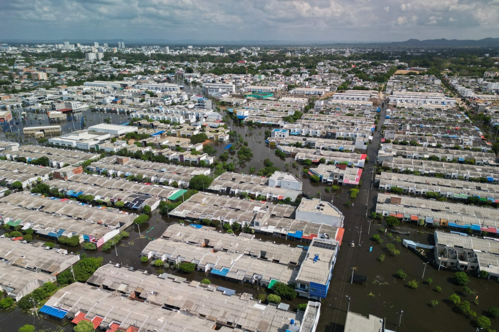 Aerial view of flooded streets in Monteria, Colombia taken on February 9, 2026. (Photo by AFP)