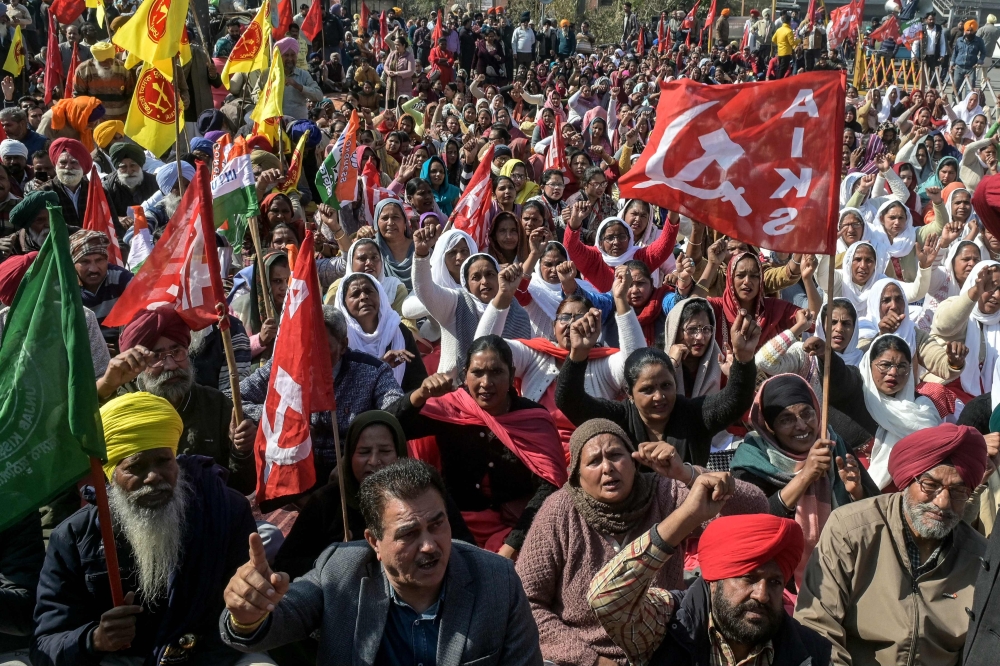Farmers and trade union workers shout slogans during a nationwide strike over government policies and other issues in Amritsar on February 12, 2026. (Photo by Narinder Nanu / AFP)