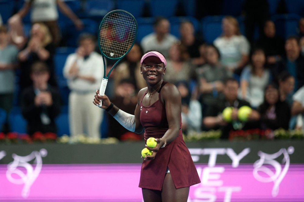 Canada's Victoria Mboko reacts after beating Latvia's Jelena Ostapenko in semi-final match at the Qatar Open tennis tournament in Doha on February 13, 2026. (Photo by Karim Jaafar / AFP)