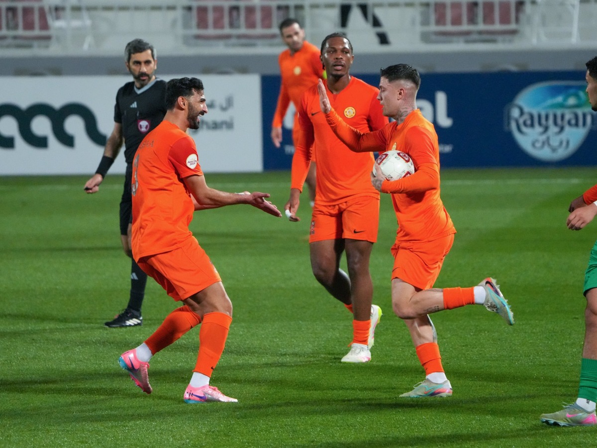 Umm Salal players celebrate a goal during match against Al Ahli. 