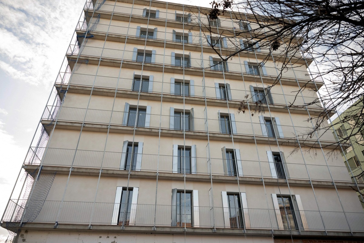 A building designated for affordable social rental housing is pictured on February 13, 2025 in Sant Boi de Llobregat. Photo by Josep LAGO / AFP