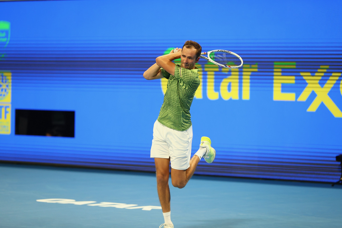 Russia's Daniil Medvedev hits a return to China's Shang Juncheng.