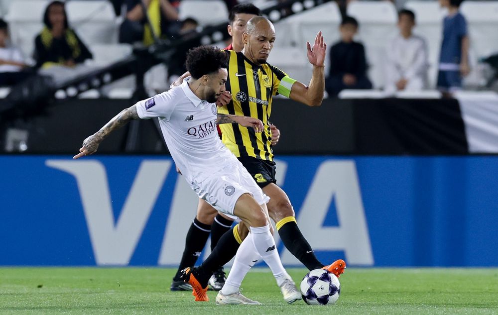 Action during match between Al Sadd and Al Ittihad.