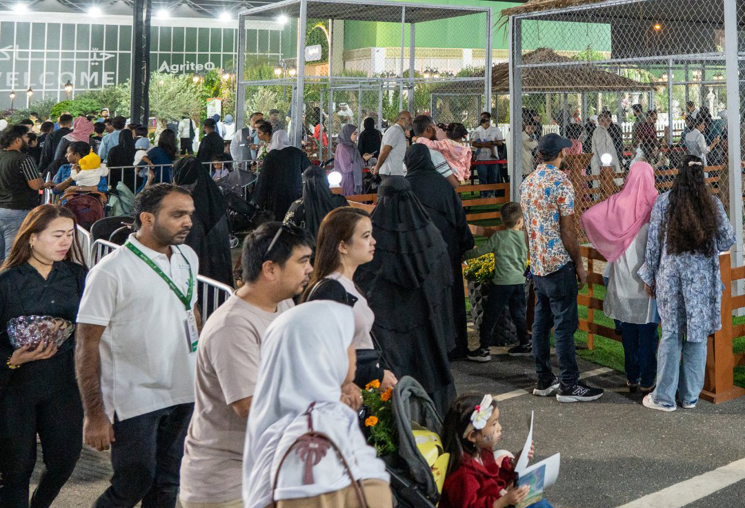 People visiting the exhibition at Katara. 