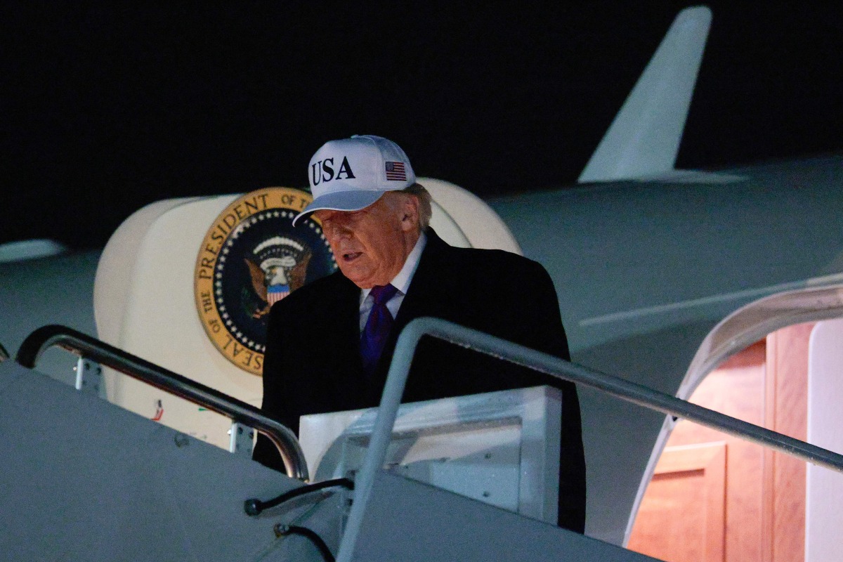 U.S. President Donald Trump steps off of Air Force One after returning to the nation's capital on February 19, 2026 at Joint Base Andrews, Maryland. Photo by CHIP SOMODEVILLA / GETTY IMAGES NORTH AMERICA / Getty Images via AFP