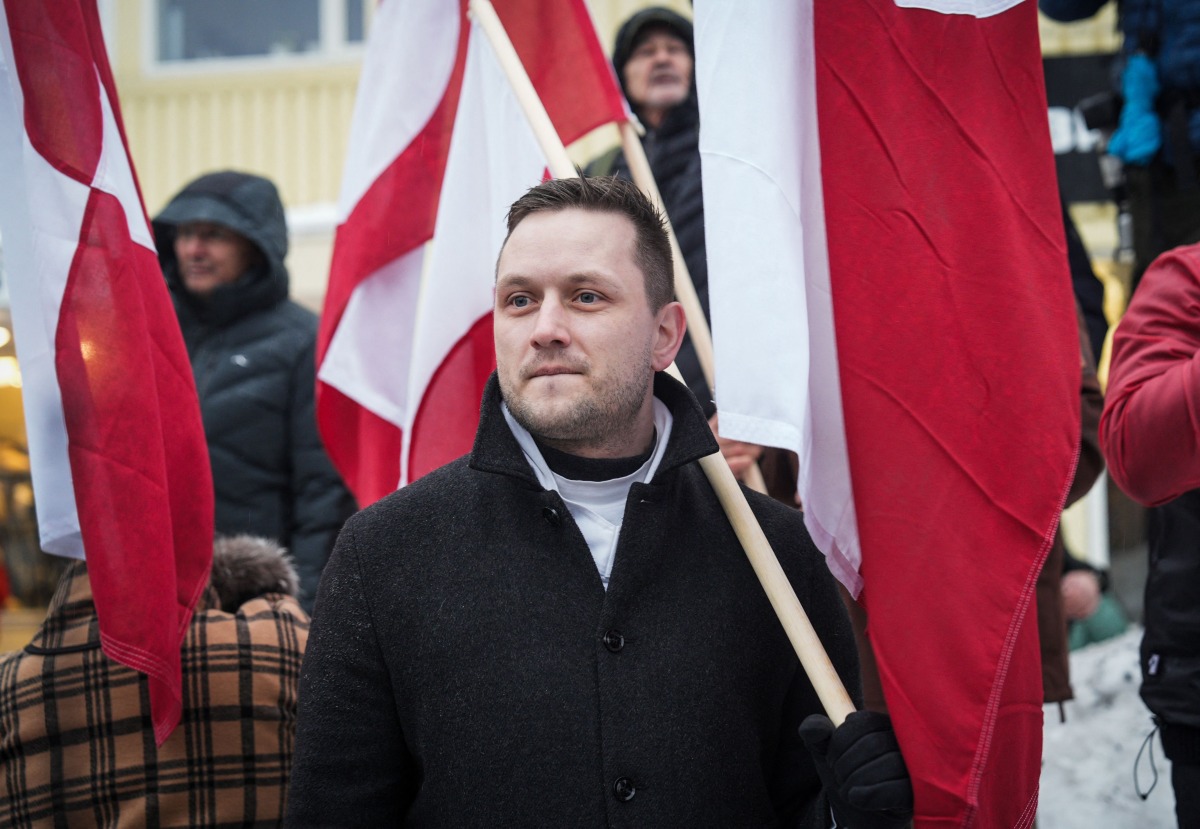 Greenlandic Prime Minister Jens-Frederik Nielsen takes part in a demonstration that gathered almost a third of the city population to protest against the US President's plans to take Greenland, on January 17, 2026 in Nuuk, Greenland. Photo by Alessandro RAMPAZZO / AFP