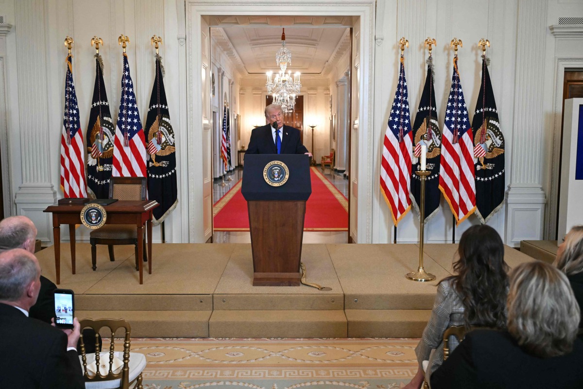 US President Donald Trump speaks during the Angel Families Remembrance Ceremony in the East Room of the White House in Washington, DC, on February 23, 2026. (Photo by SAUL LOEB / AFP)