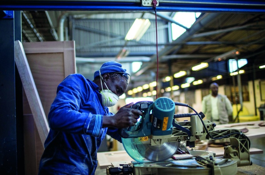 A worker cuts wood at the Furntech Workshop in Johannesburg, South Africa. Representational file photo.