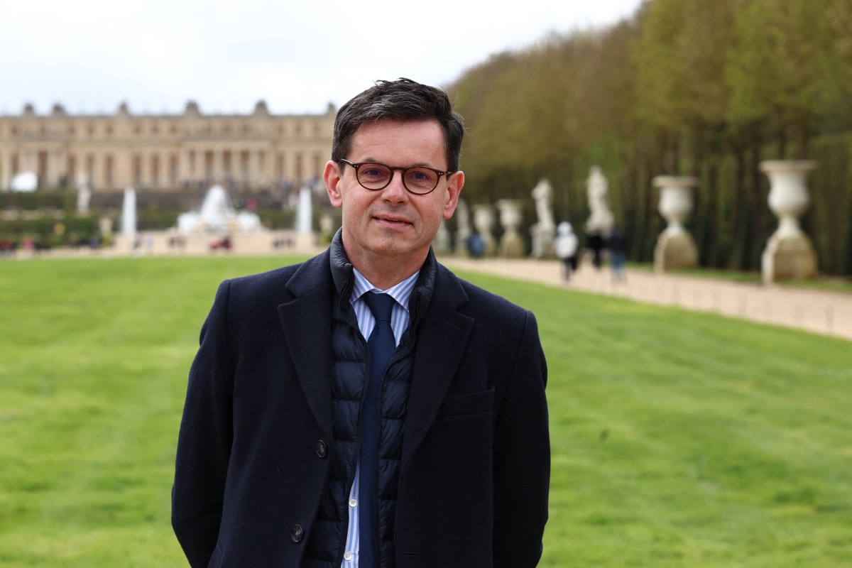 Head of the Chateau de Versailles domain, Christophe Leribault, poses for photographs, on the sidelines of a media tour of the Paris 2024 Olympic and Paralympic venue infrastructure in Versailles, southwest of Paris, on March 29, 2024. Photo by EMMANUEL DUNAND / AFP