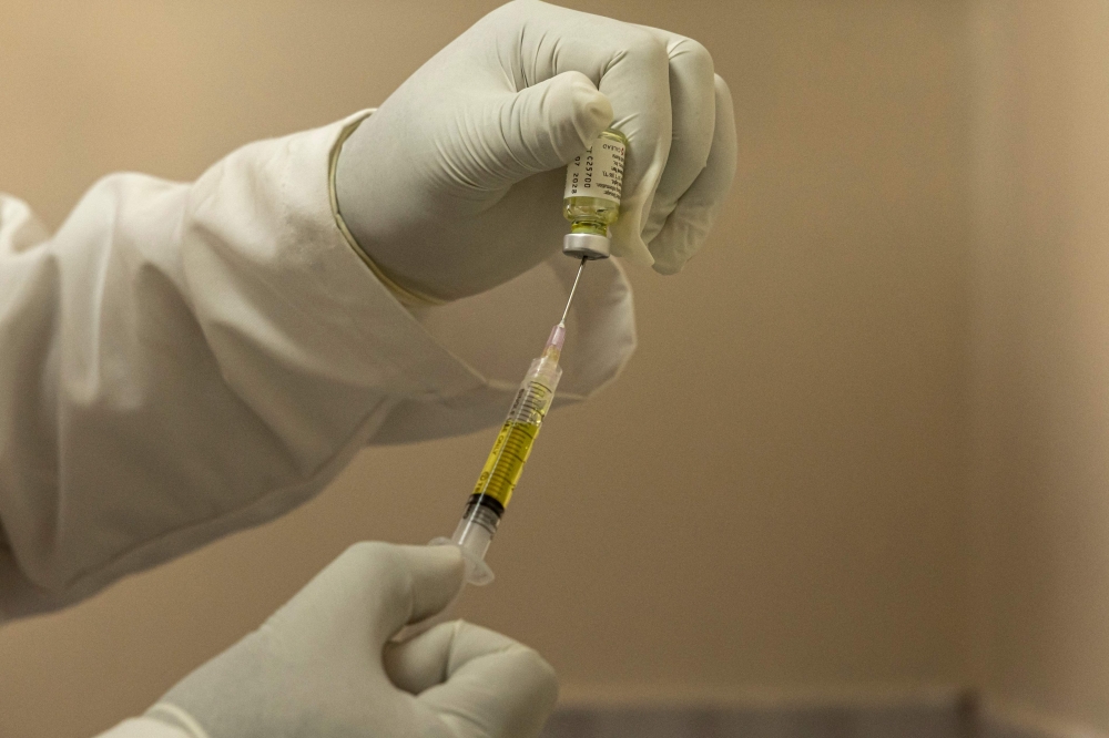 A clinician fills a syringe a dose of the long-acting injectable HIV pre-exposure prophylaxis (PrEP), Lenacapavir injection before administering to a client, during its launch marking the first phase of the national rollout at the Riruta Health Centre in Nairobi on February 26, 2026. (Photo by Simon Maina / AFP)