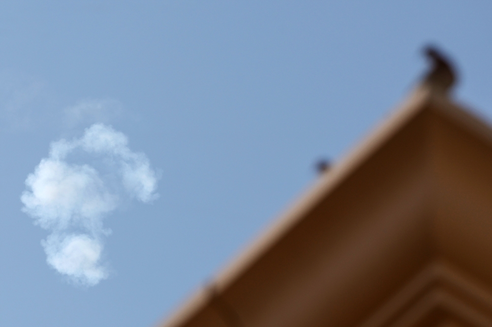 Smoke from a rocket reportedly intercepting an Iranian missile is seen over the sky in Doha on February 28, 2026. (Photo by Karim Jaafar / AFP)