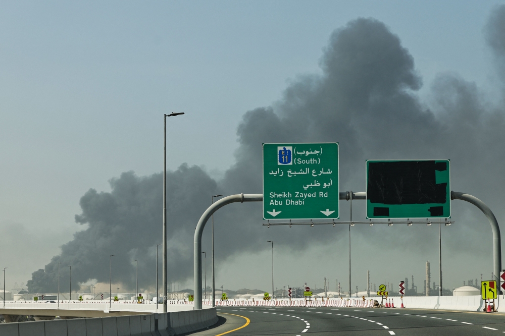 A plume of smoke rises from the port of Jebel Ali following a reported Iranian strike in Dubai on March 1, 2026. (Photo by Fadel Senna / AFP)