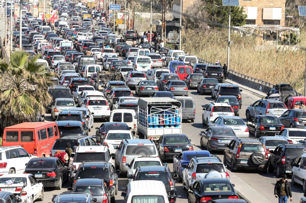 Motorists block the highway as they flee their villages in southern Lebanon along the coastal road through the city of Sidon on March 2, 2026.(Photo by Mahmoud Zayyat / AFP)