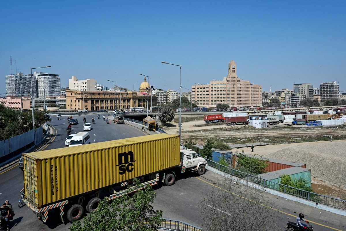 A truck troller is parked to block the road leading to the US Consulate in Karachi on March 2, 2026. Photo by Asif Hassan / AFP
