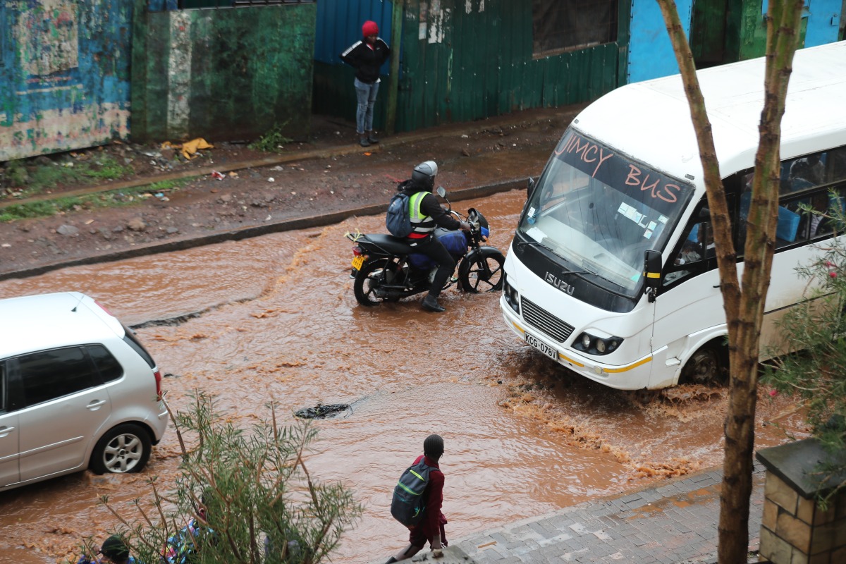 Vehicles move on a flooded road after a heavy rain in Kibera of Nairobi, Kenya, on March 7, 2026. (Photo by Henry Naminde/Xinhua)